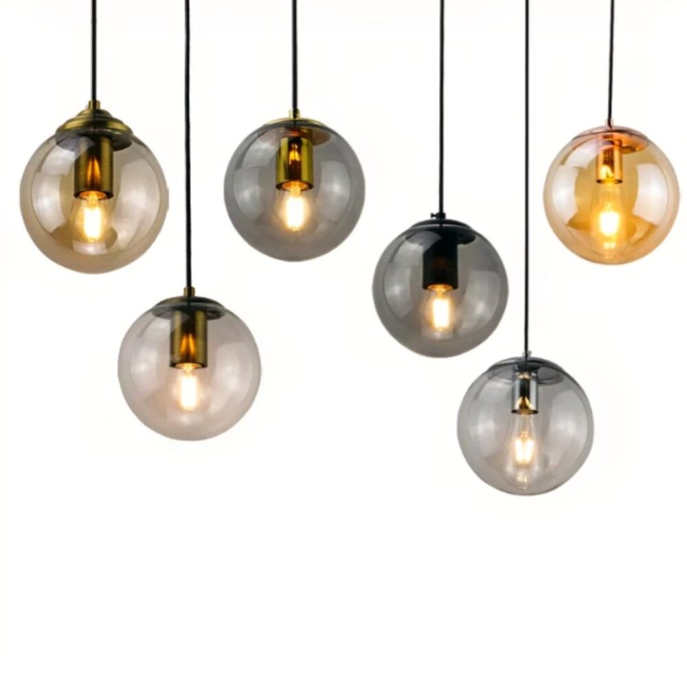 Six suspensions boule en verre de couleurs variées ambré, gris fumé et transparent