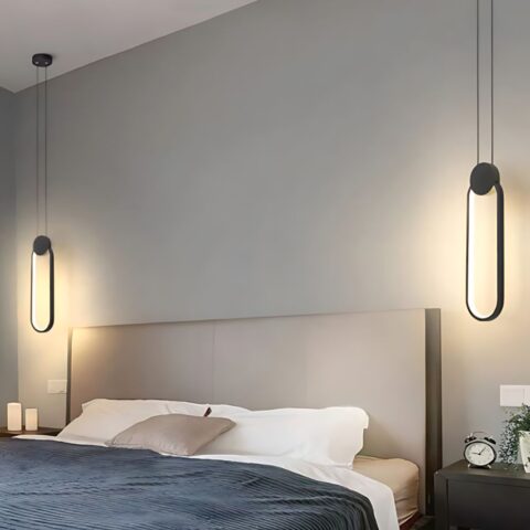 2 Suspension LED design minimaliste ovale noir au dessus de deux tables de chevet autour d'un lit