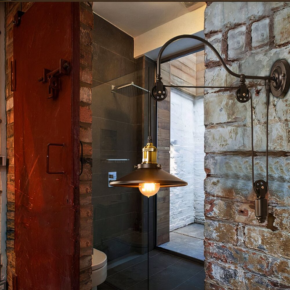 Applique murale en fer forgé avec poulie