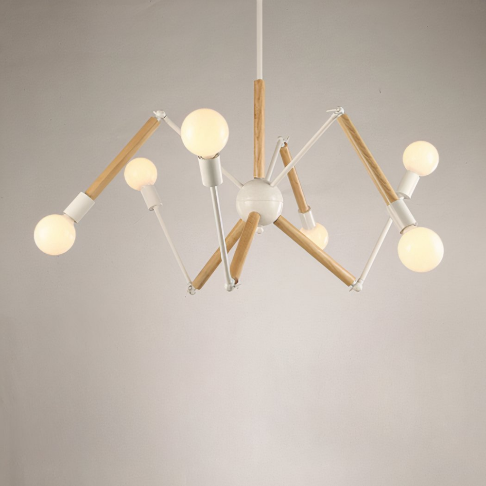Lustre araignée multi-têtes industriel rétro Lustre araignée, en tiges de métal blanc et bois, avec une ampoule au bout de chaque tige. Suspendu, un mur blanc dans le fond.