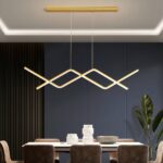 Suspension de cuisine LED design, avec support couleur doré dans une salle à manger