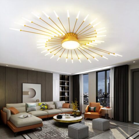 Lustre plafonnier doré moderne LED en métal style feu d'artifice accroché au plafond d'un salon, au-dessus d'un canapé et d'une table