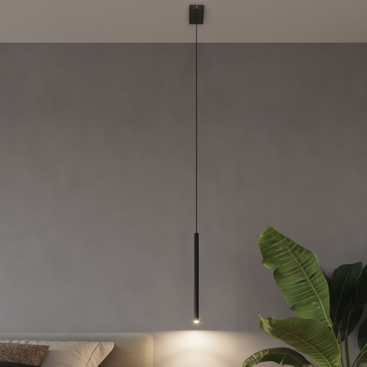 Suspension design toute fine en métal noir sur un mur gris