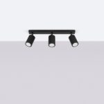 Lustre plafonnier design rainuré 3 spots modulables noirs sur plafond blanc et fond gris.