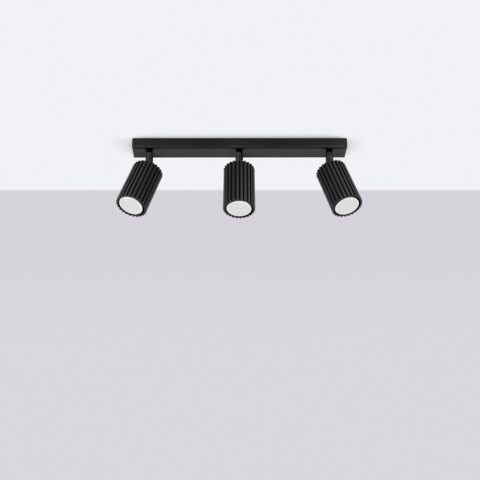 Lustre plafonnier design rainuré 3 spots modulables noirs sur plafond blanc et fond gris.