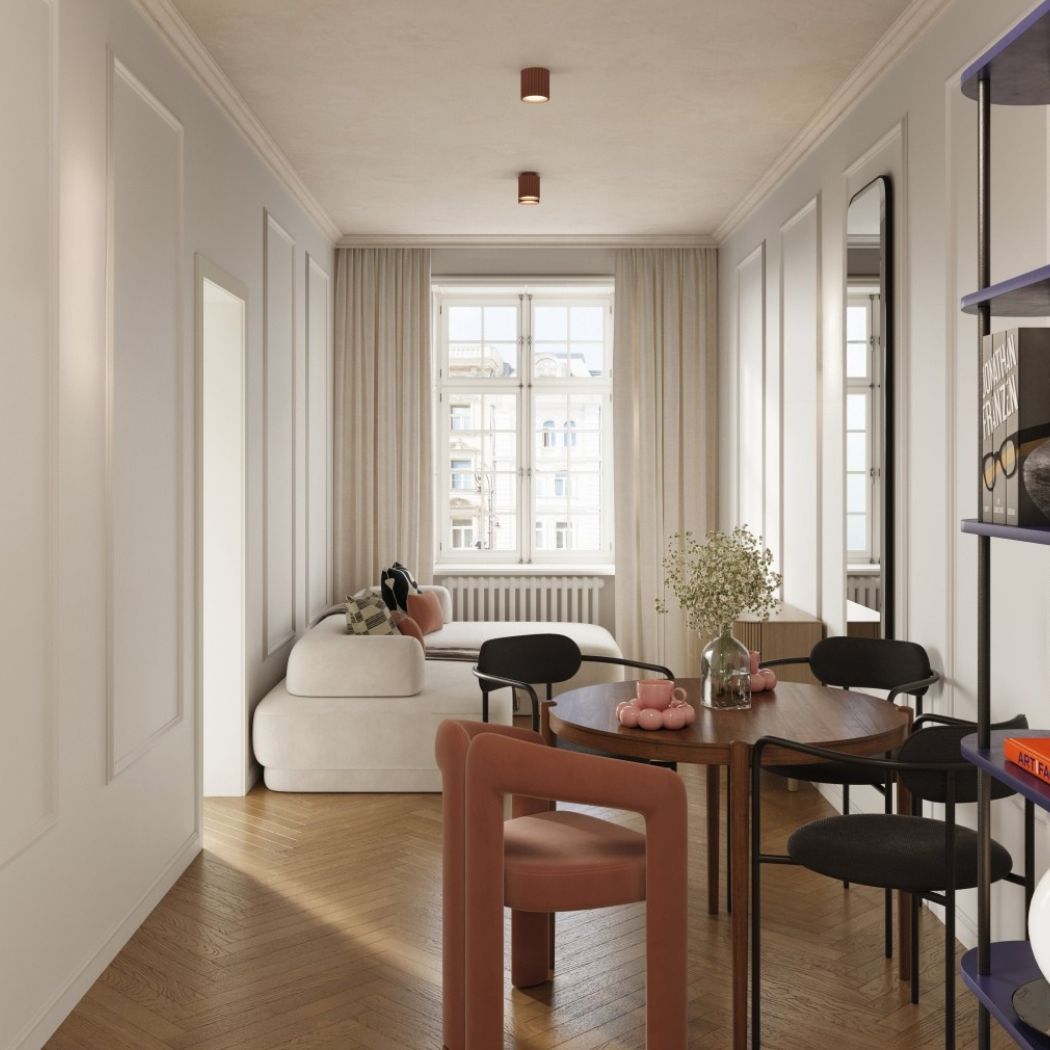 Couloir avec deux spots ronds cuivrés au plafond au-dessus d'un parquet en chevrons
