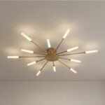 Lustre plafonnier LED pissenlit doré design, à 12 LED fixé sur un plafond beige.