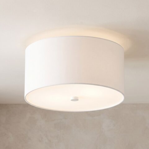 Plafonnier cylindre en tissu blanc allumé au plafond